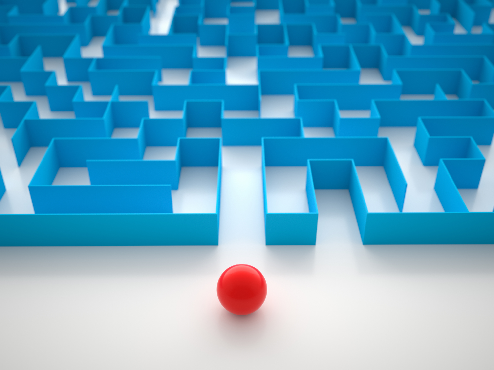 A red ball at the entry to a blue maze.