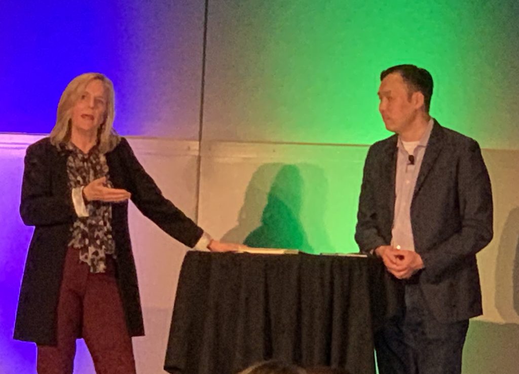 Liz Arndt and Evan Liang speaking at the 2022 Forrester B2B Summit North America.