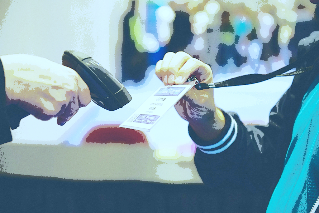 Scanning a badge at a trade show.