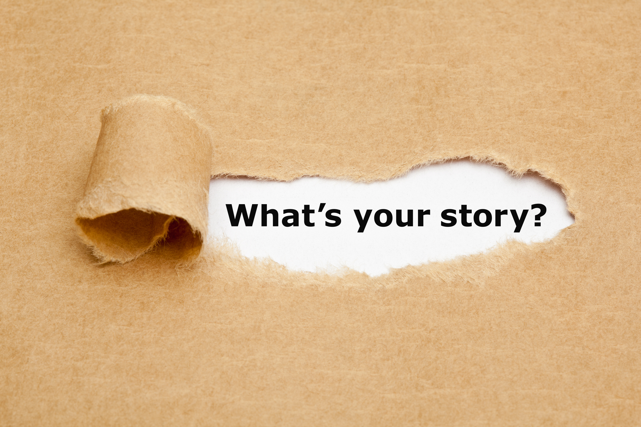 The text 'What's Your Story?' appearing behind torn brown paper.