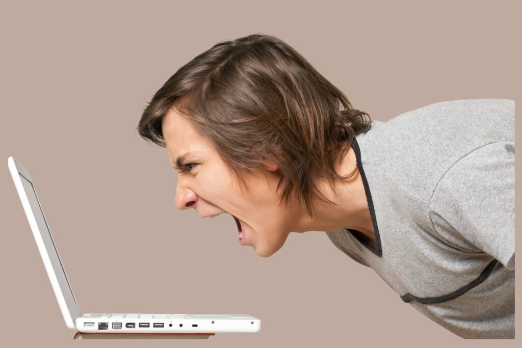 Image of a computer user screaming in frustration.