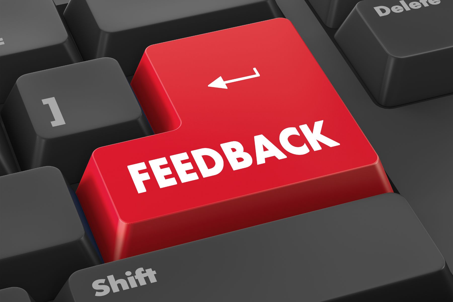 red button on a computer keyboard that says Feedback on it