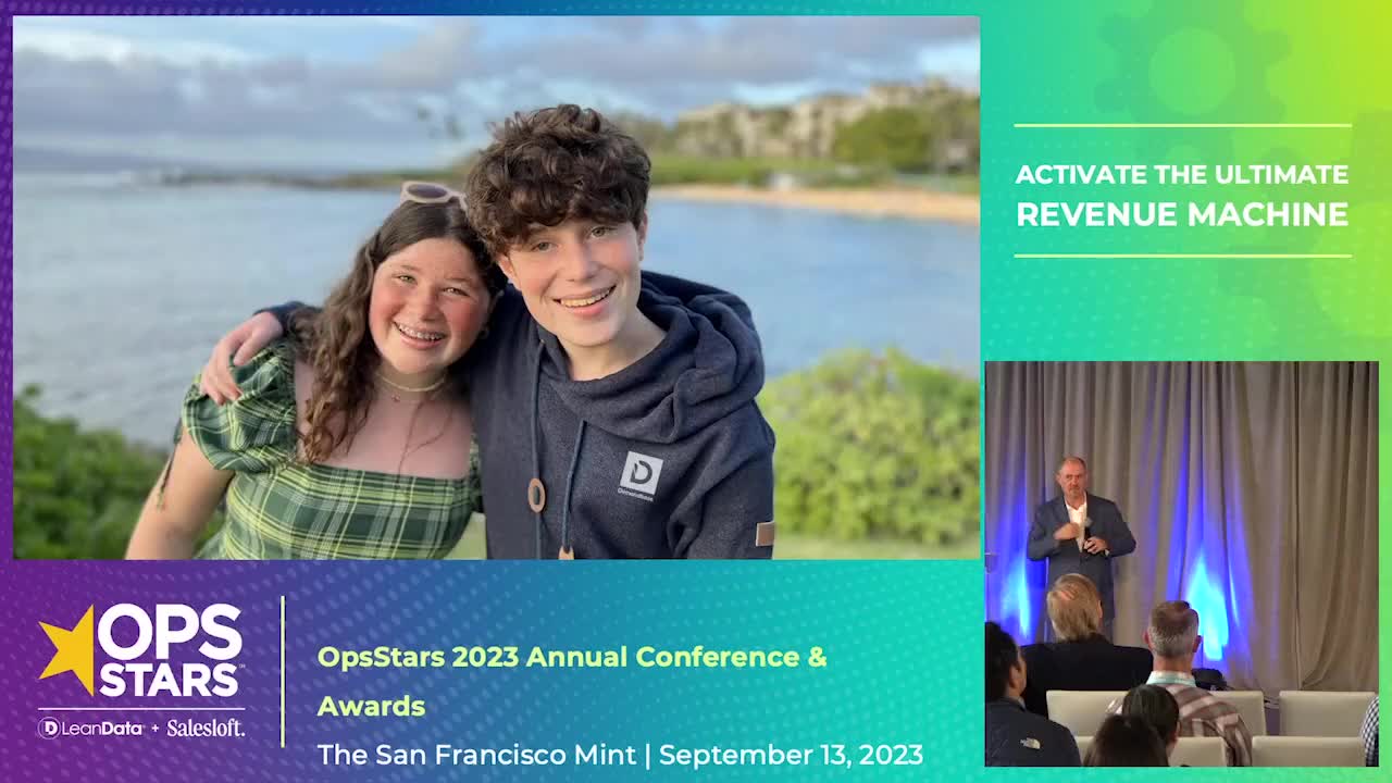 A blue and green gradient rectangle with an image of Jon Miller from the OpsStars 2023 conference