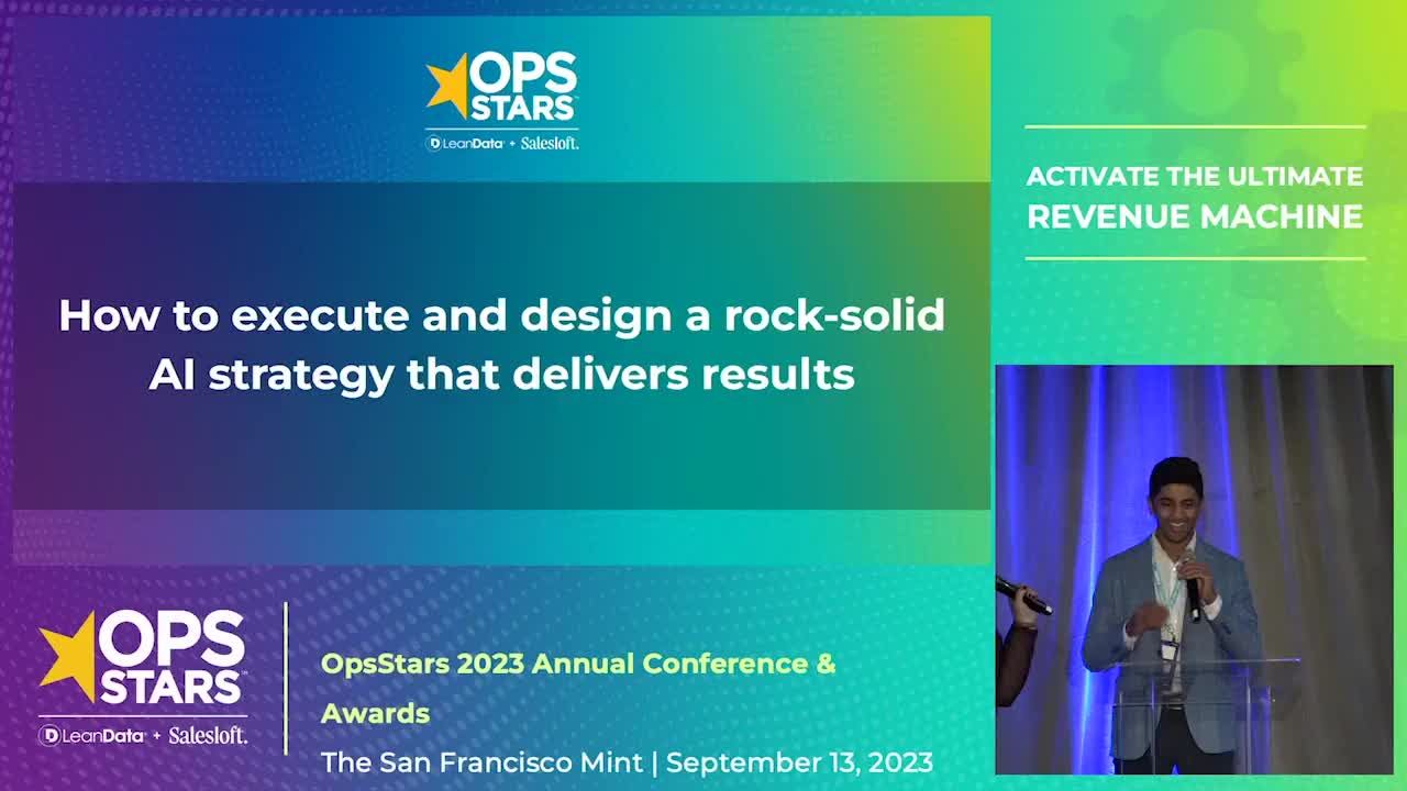 A blue and green gradient rectangle with a photo image of a speaker at the 2023 OpsStars conference
