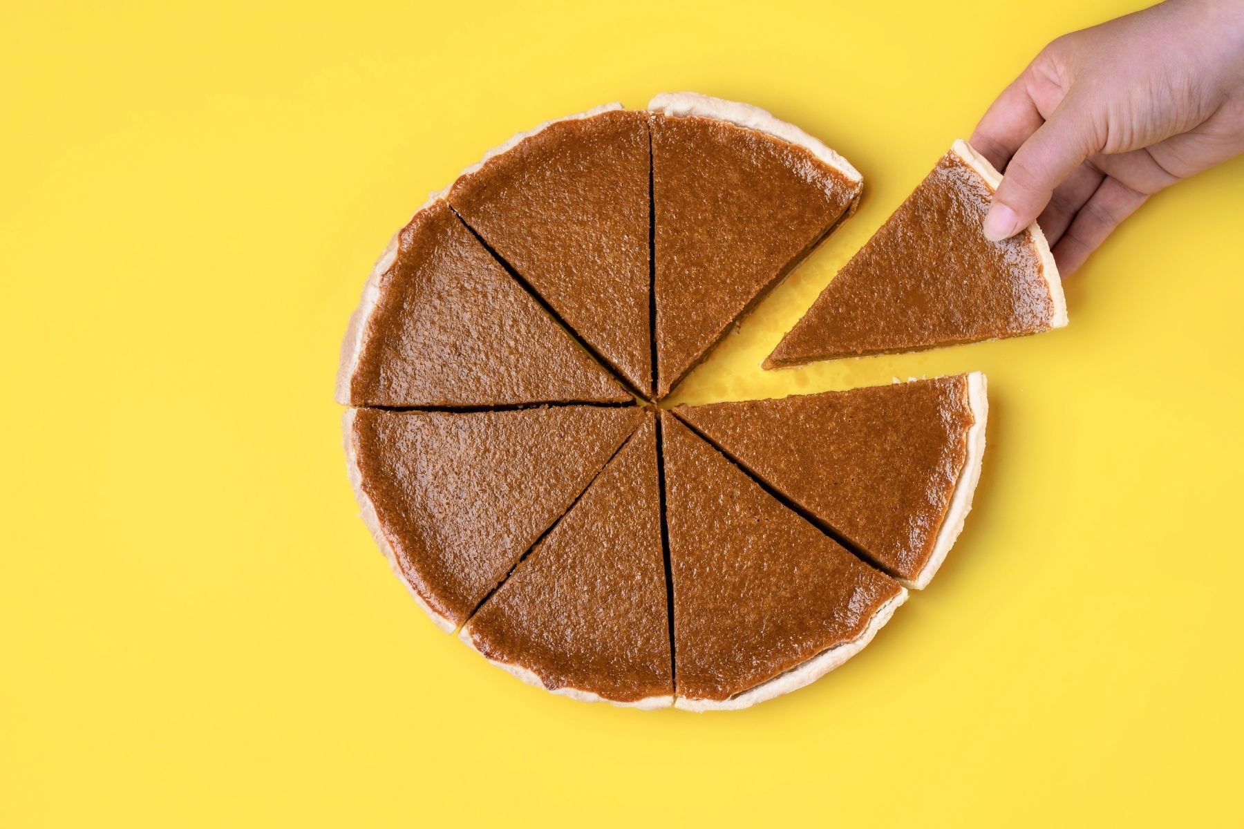 a pumpkin pie cut into eight equal pieces