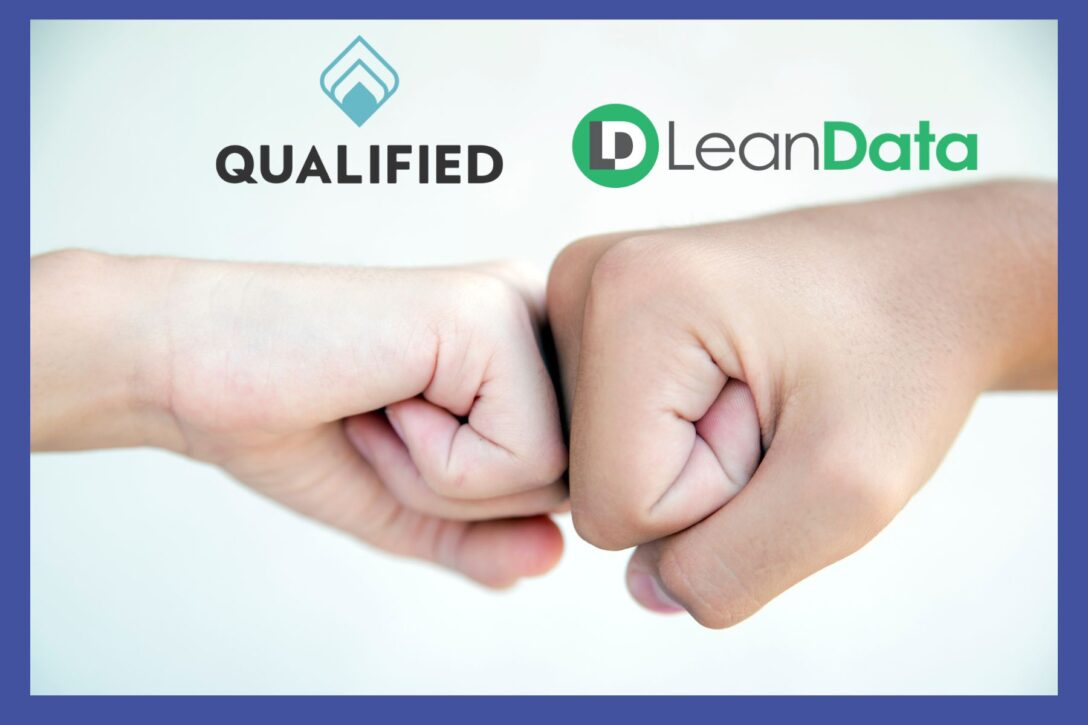 a photo of a fist bump between Qualified and LeanData