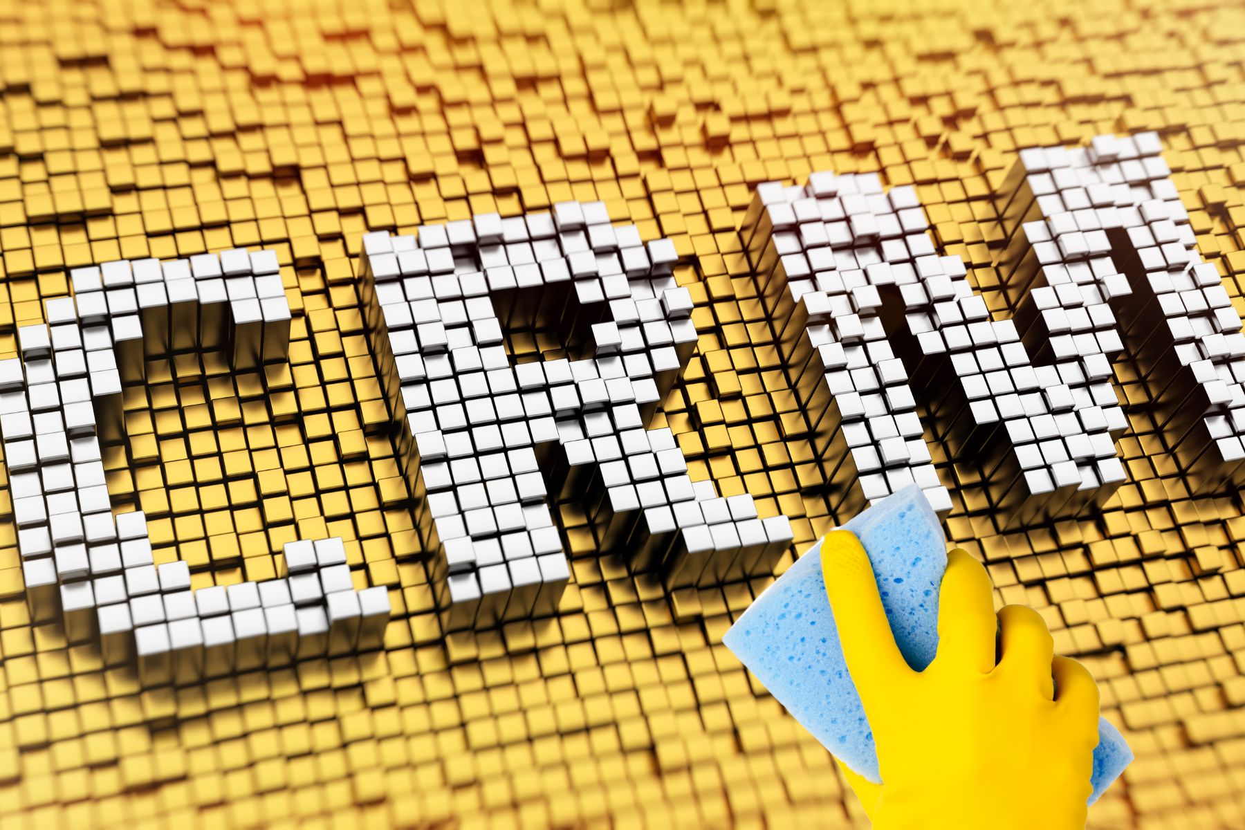 a hand holding a sponge ready to clean the letters CRM