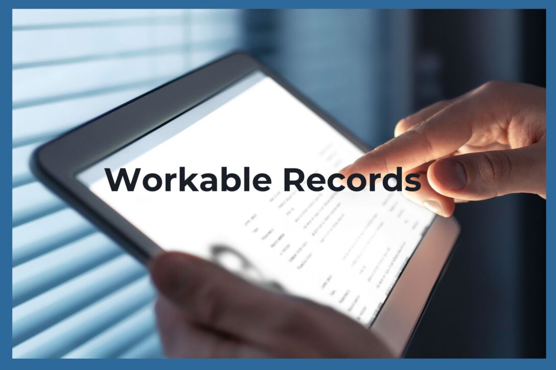 a finger pointing to a tablet with the phrase workable records across the image