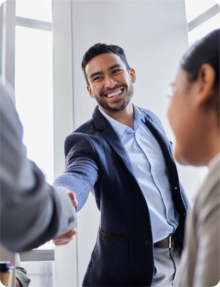 A young male professional shaking hands with someone