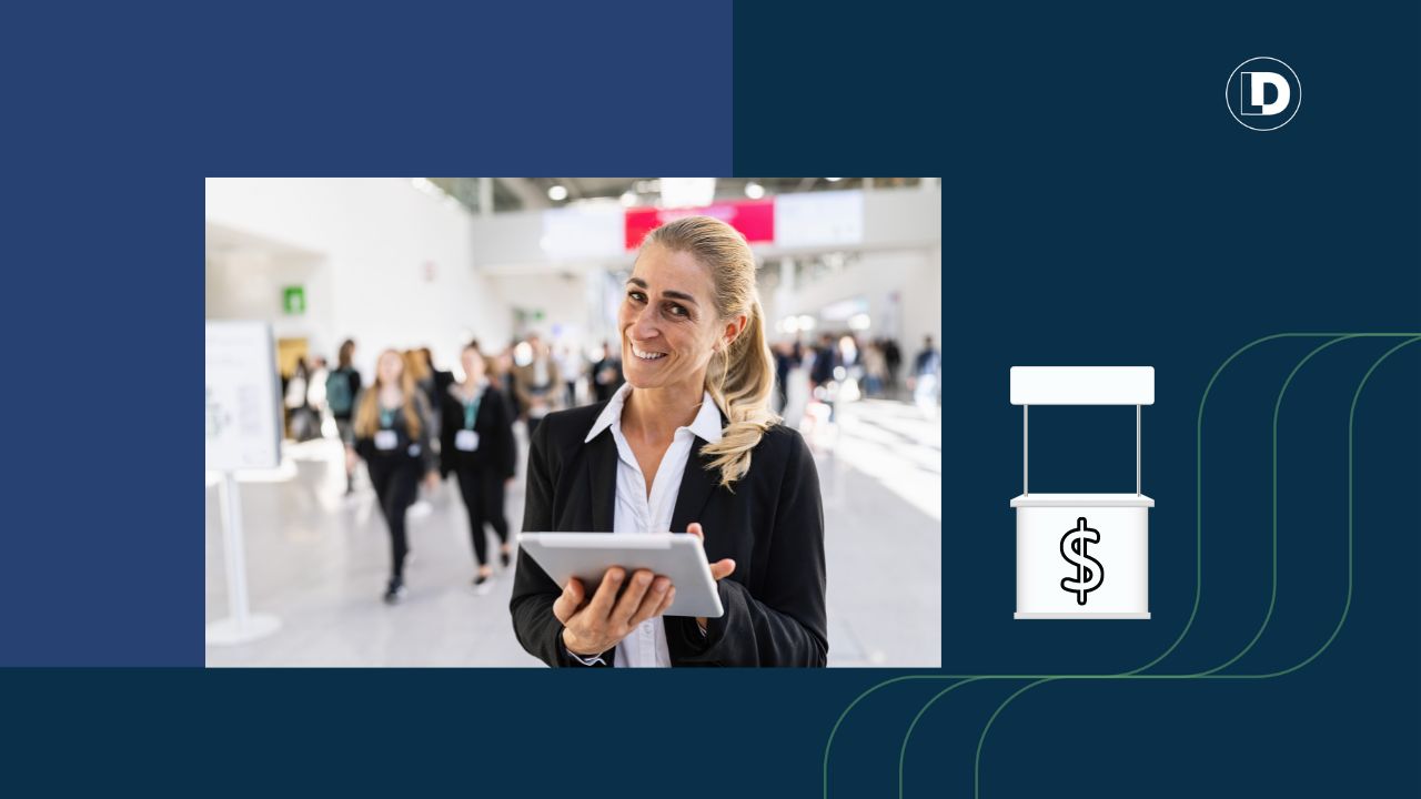 woman at a trade show holding an ipad and smiling