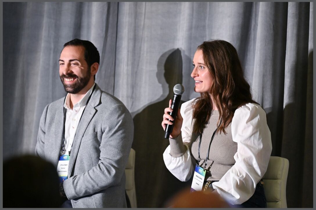 Kelly Goles and Chris Dent in a speaking session at OpsStars 2024