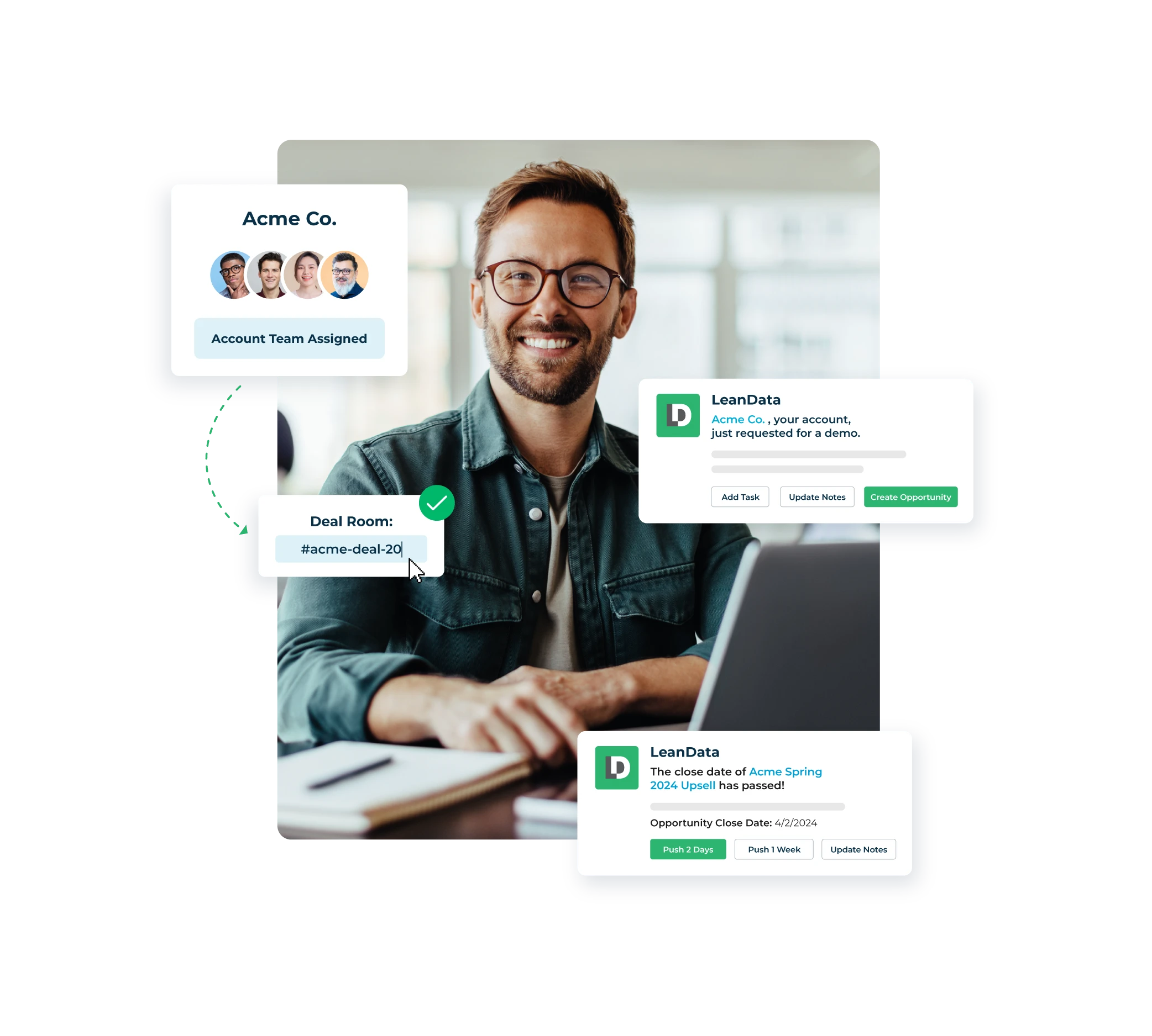 Man smiling and sitting at desk with laptop.