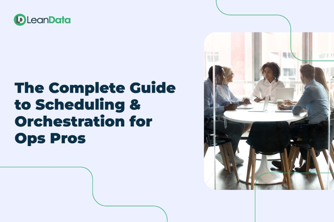Group of working professionals sitting around a conference table working on LeanData meeting scheduling and lead routing