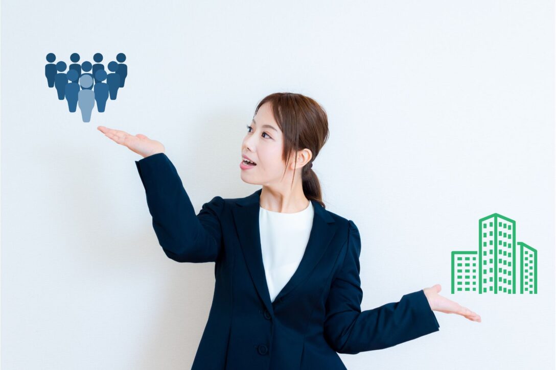 A woman holding her hands up to make a comparison between two things: Buying Groups vs. ABM
