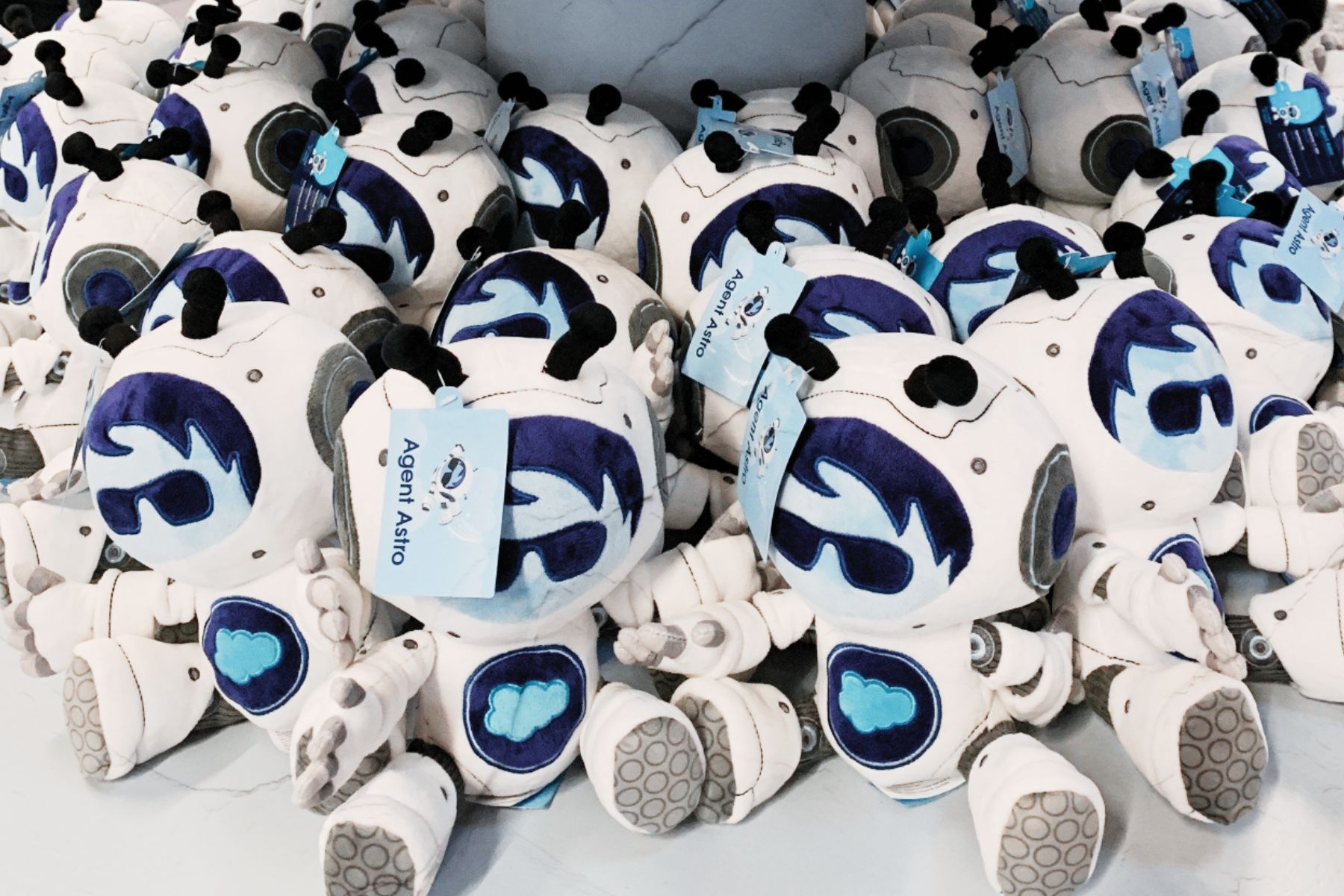 Salesforce Agent Astro stuffed animals on display