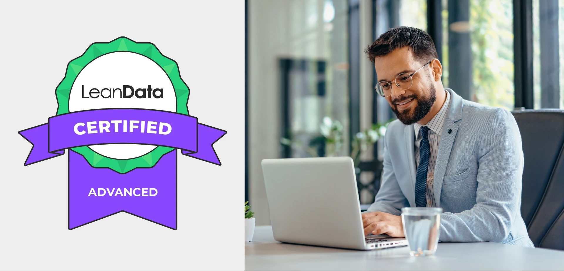 LeanData Advanced Certification - Man looking down at laptop smiling