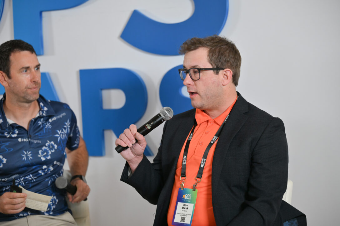 Francis Brero, Co-founder & CRO, HG Insights, and Mike Marek, Director of AI Go-to-Market and Value Engineering, Avalara, speaking at OpsStars 2025