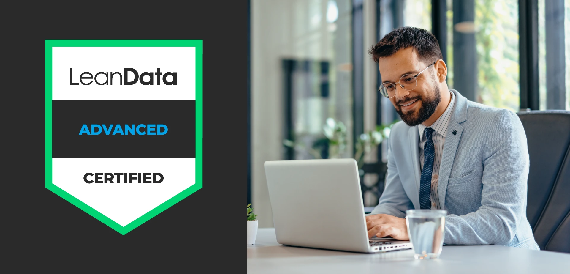 LeanData Advanced badge next to an image of a man looking down at his laptop smiling