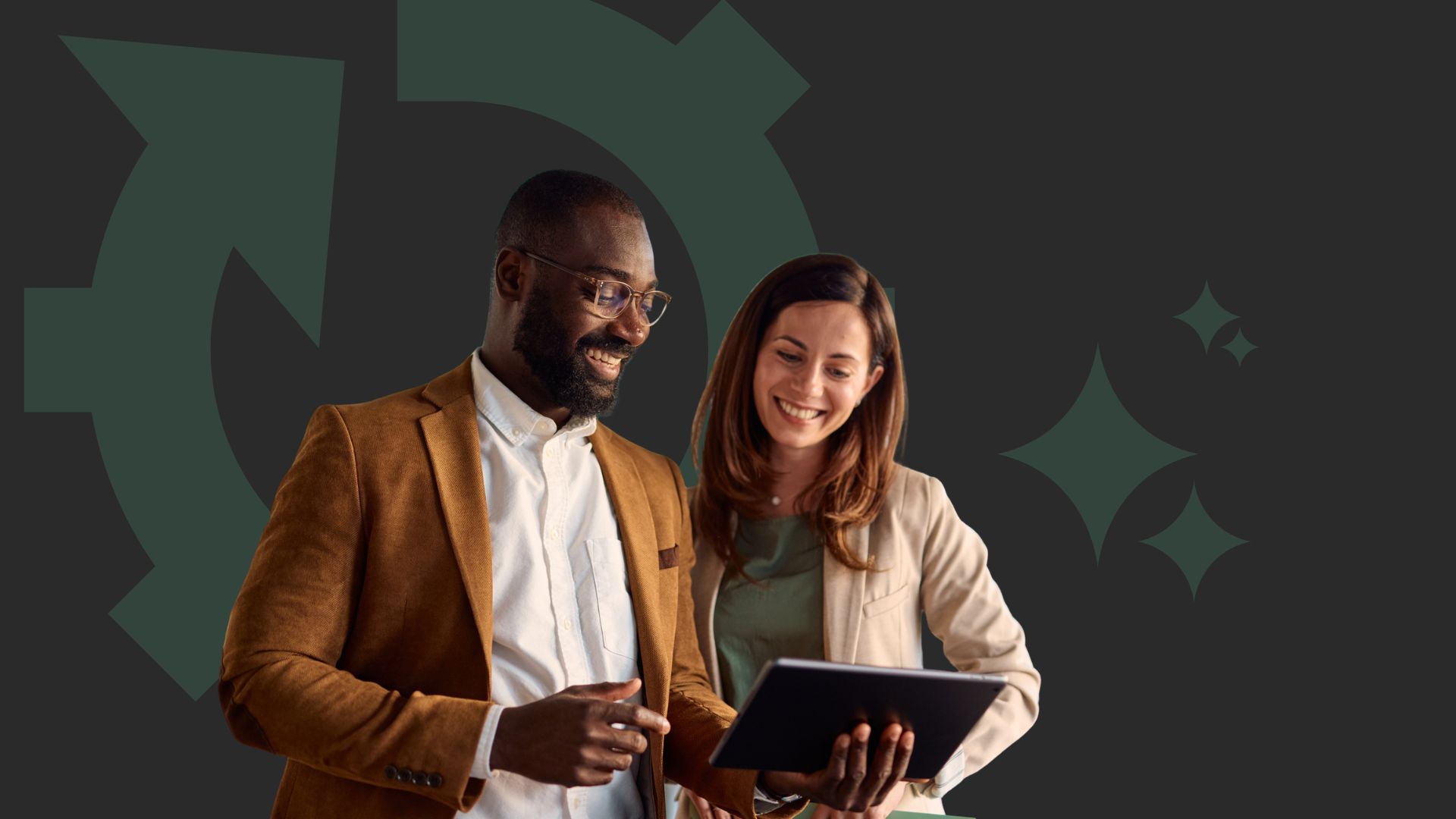 Man and woman looking at a laptop together and smiling